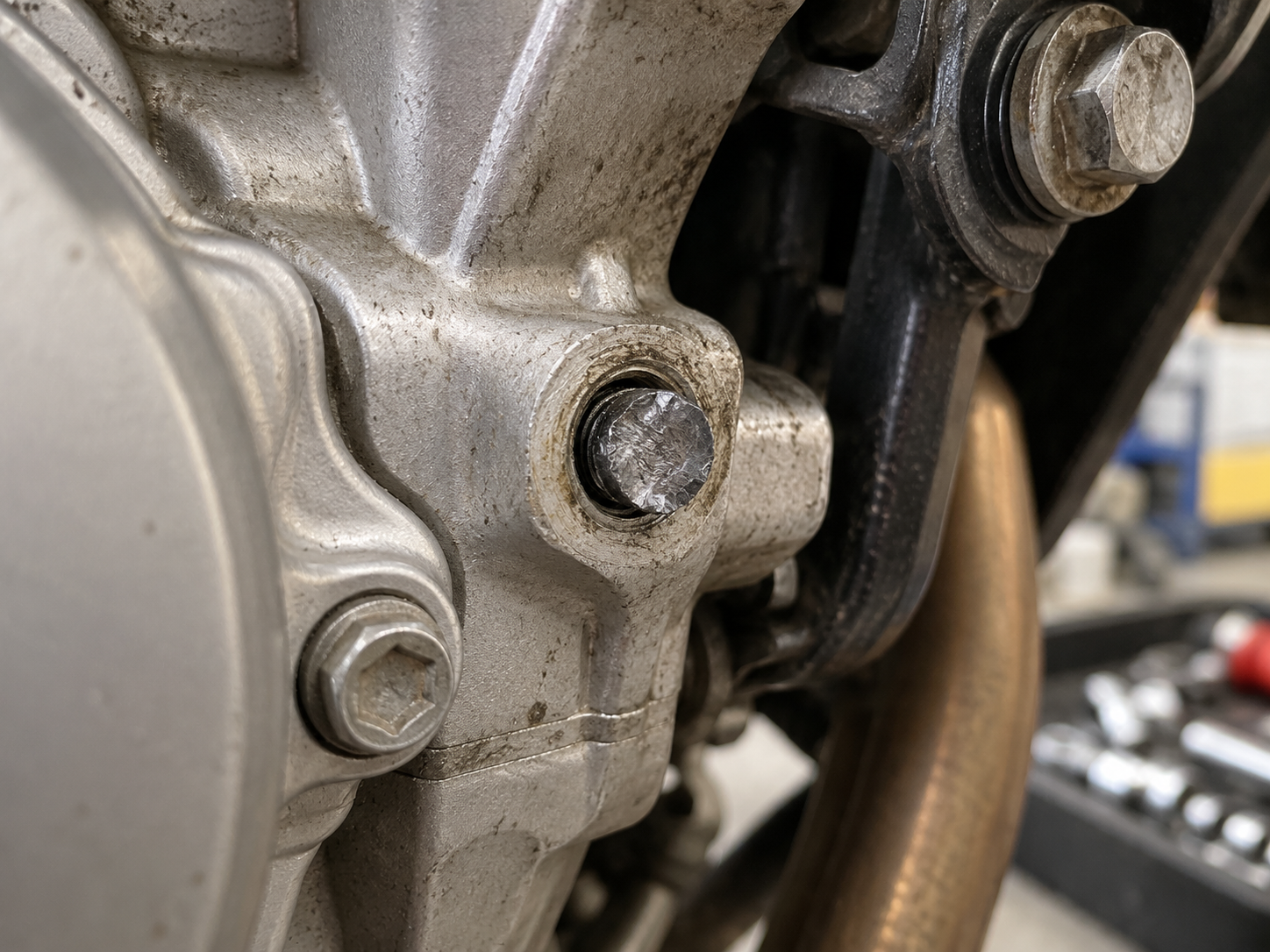Broken motorcycle bolt snapped in aluminium engine casing